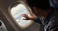 Passenger Is Partly Sucked Through Plane Window but Survives, Reports Say